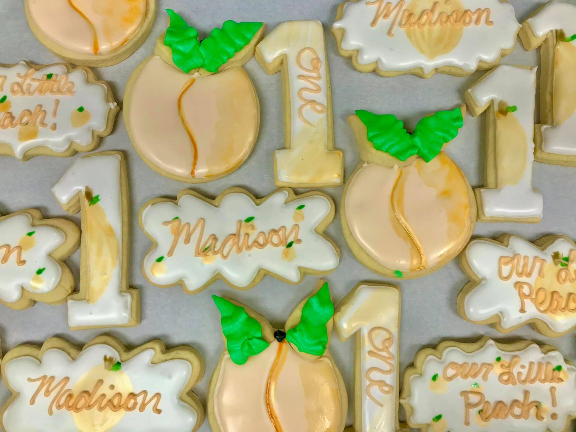a bunch of cookies with the name madison on them
