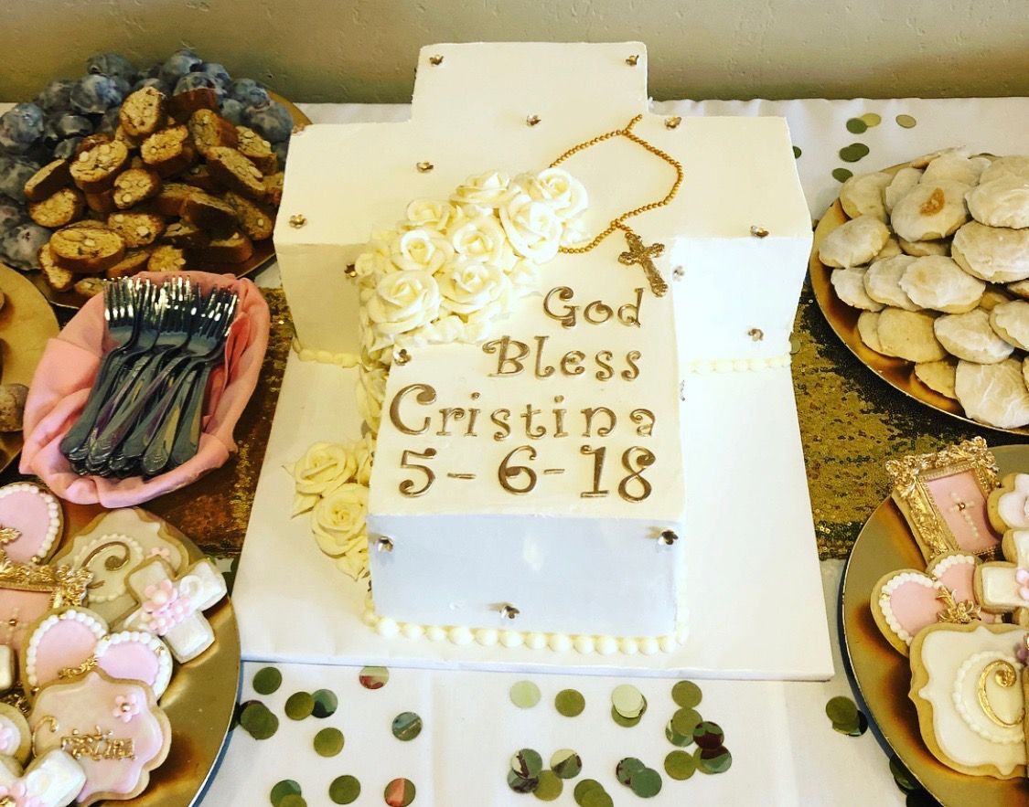 a cake that says god bless cristine is on a table