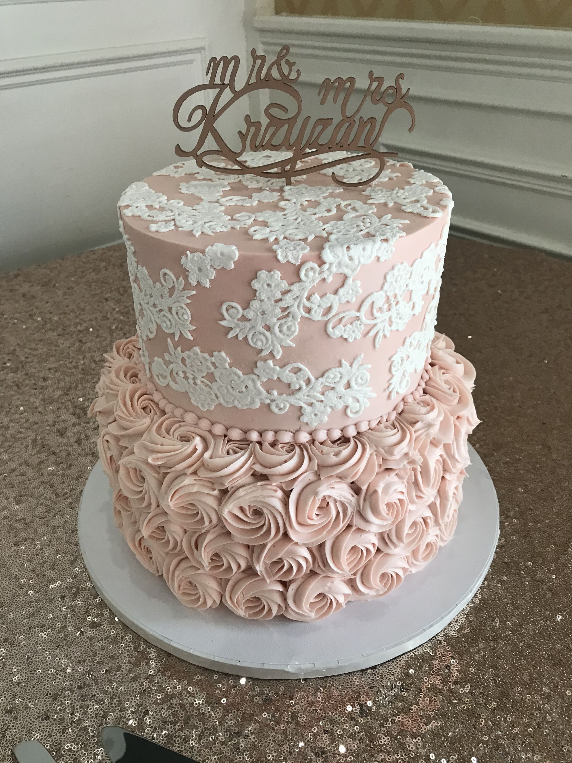 a cake with a topper that says mr. and mrs.