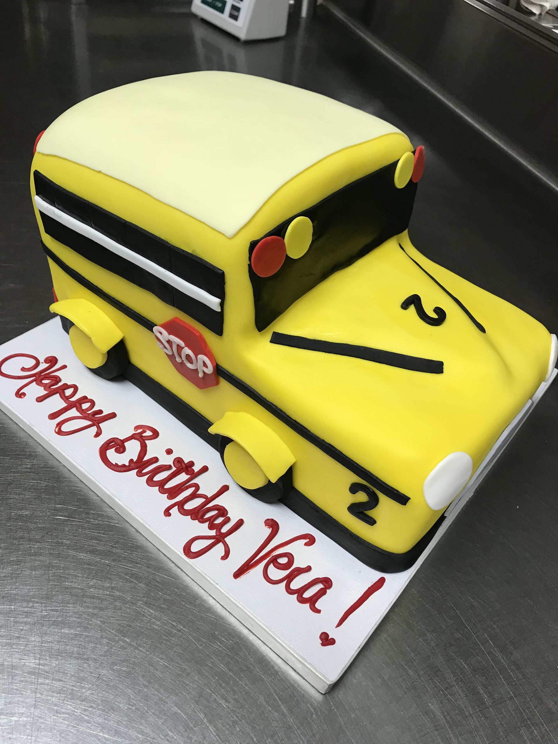 a birthday cake in the shape of a school bus