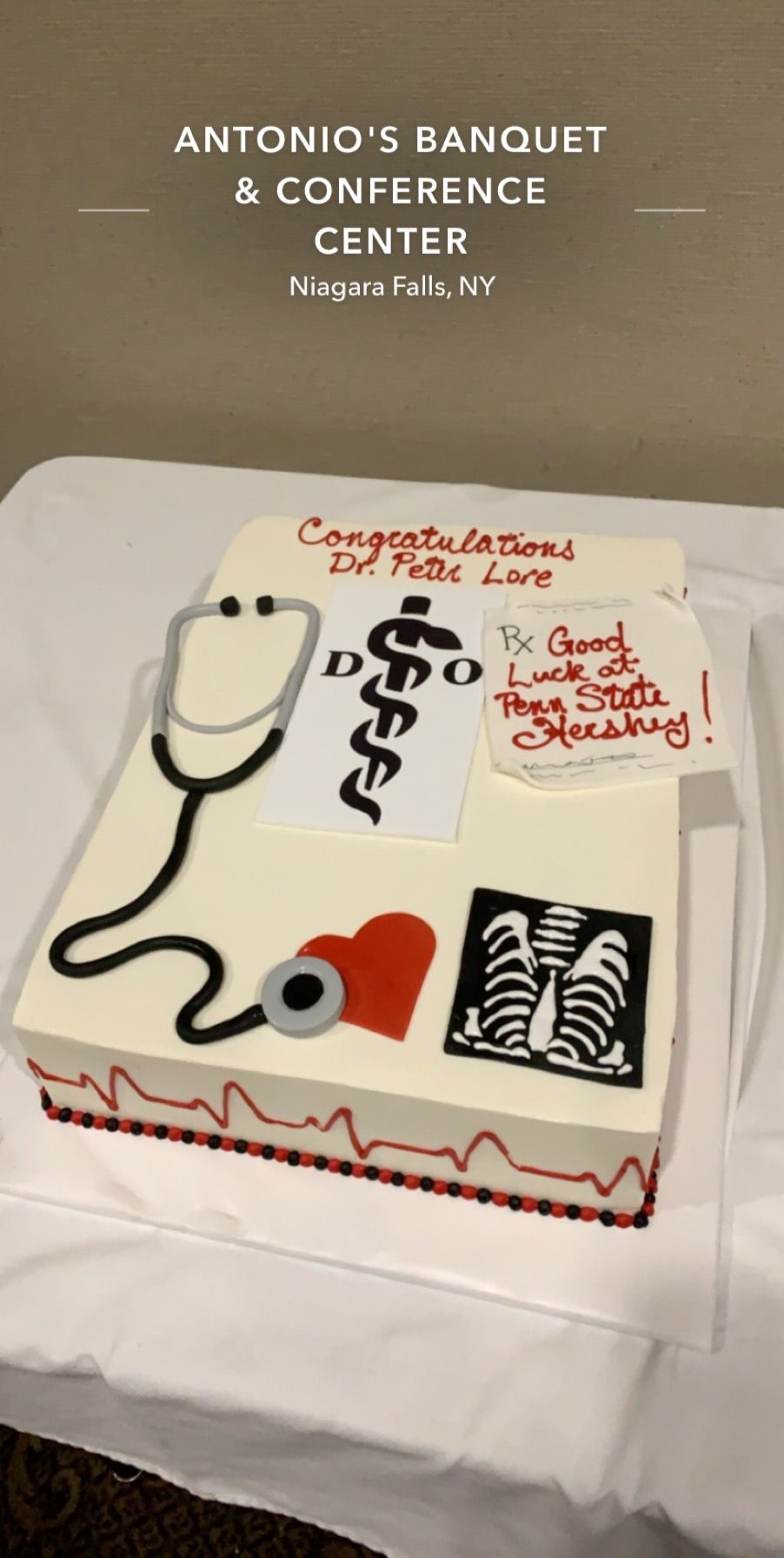 a cake with a stethoscope and x-ray on it is on a table .