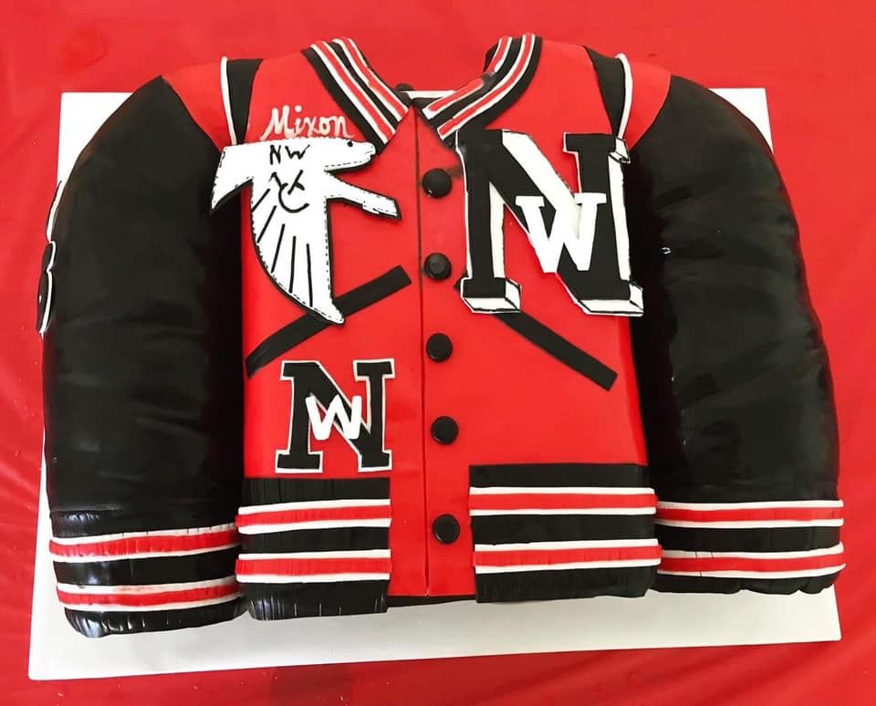 a red and black jacket with the letter m on it