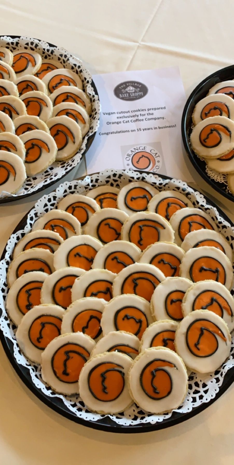 a tray of cookies with basketballs on them on a table .