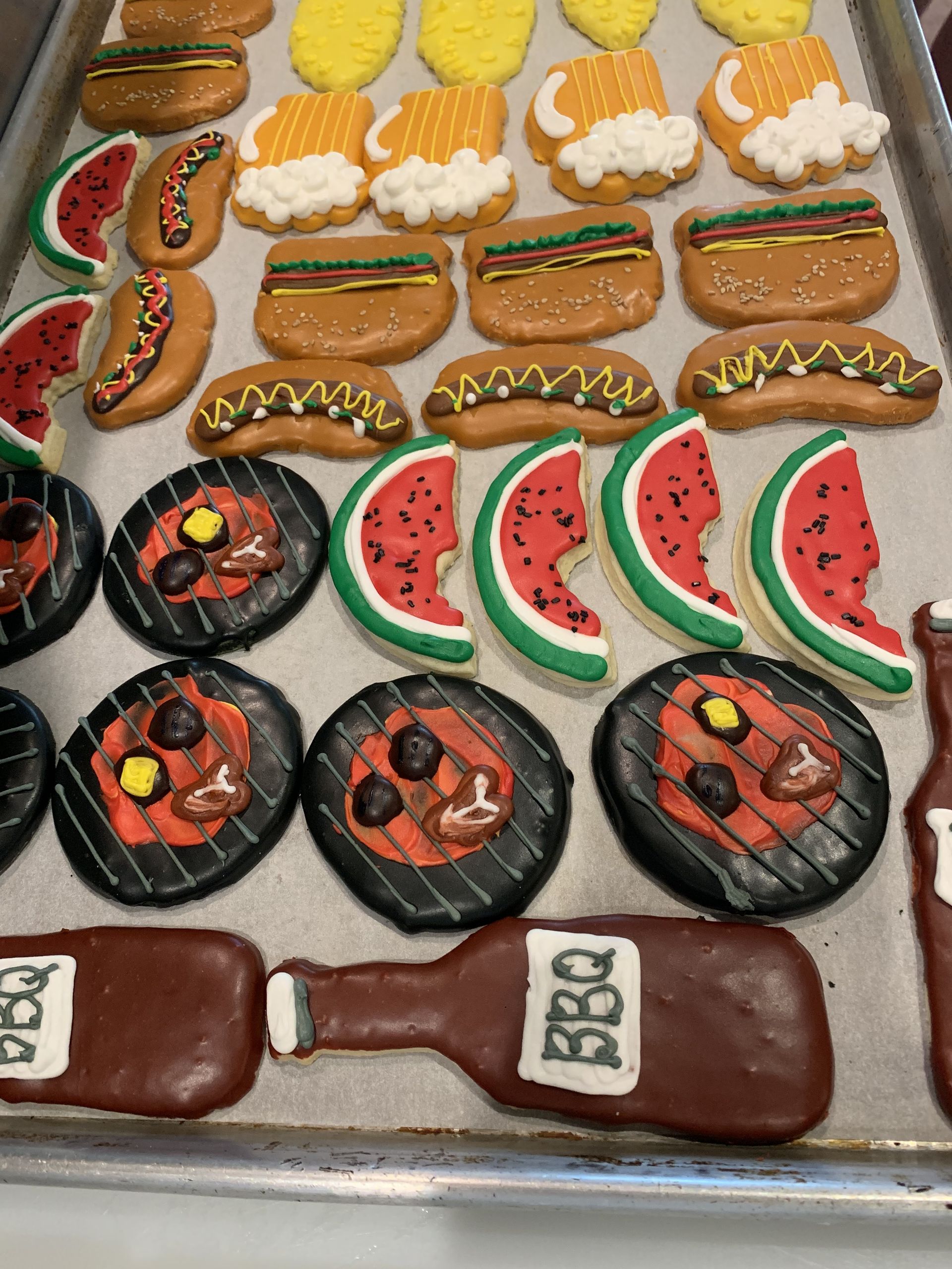 a tray of cookies with a bottle of bbq on it