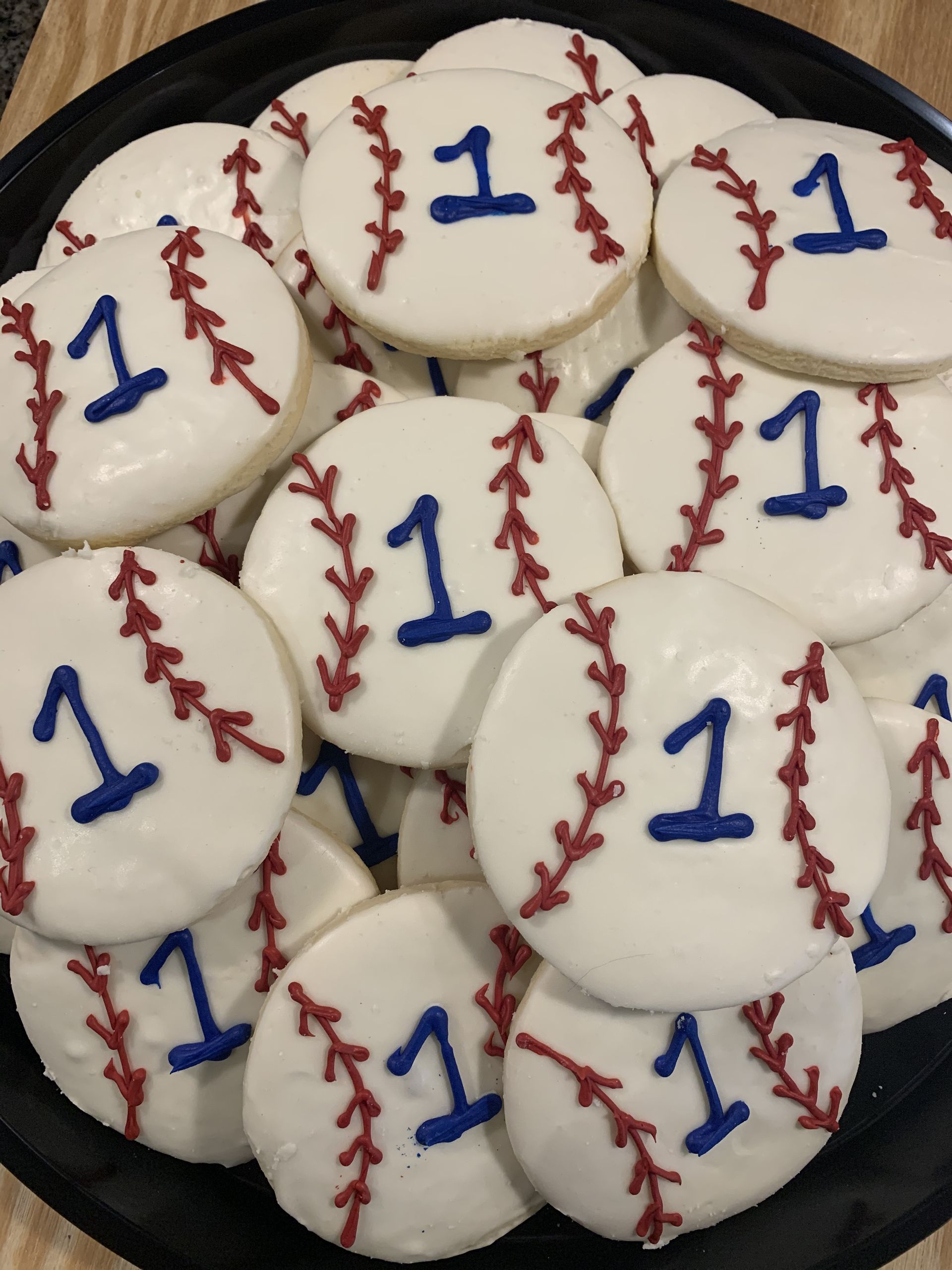 a bunch of baseball cookies with the number 11 on them