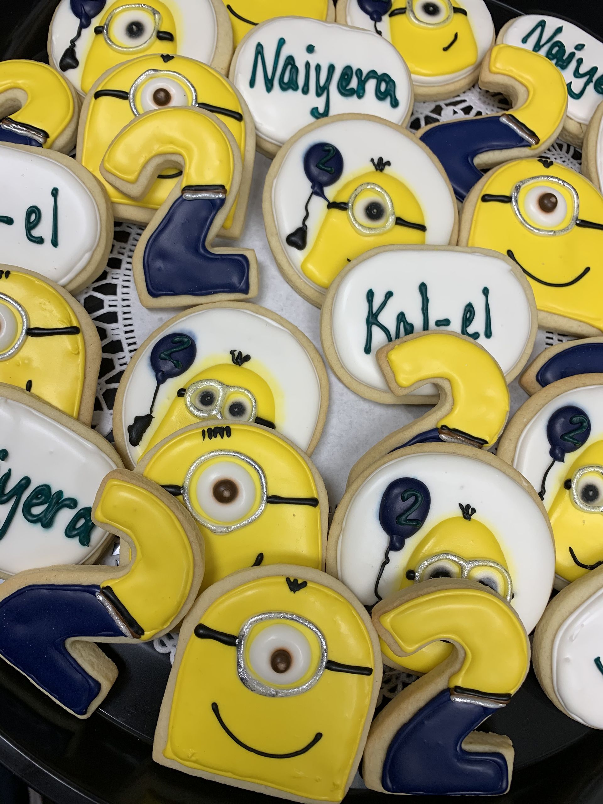 a bunch of cookies with minions and the number 2 on them
