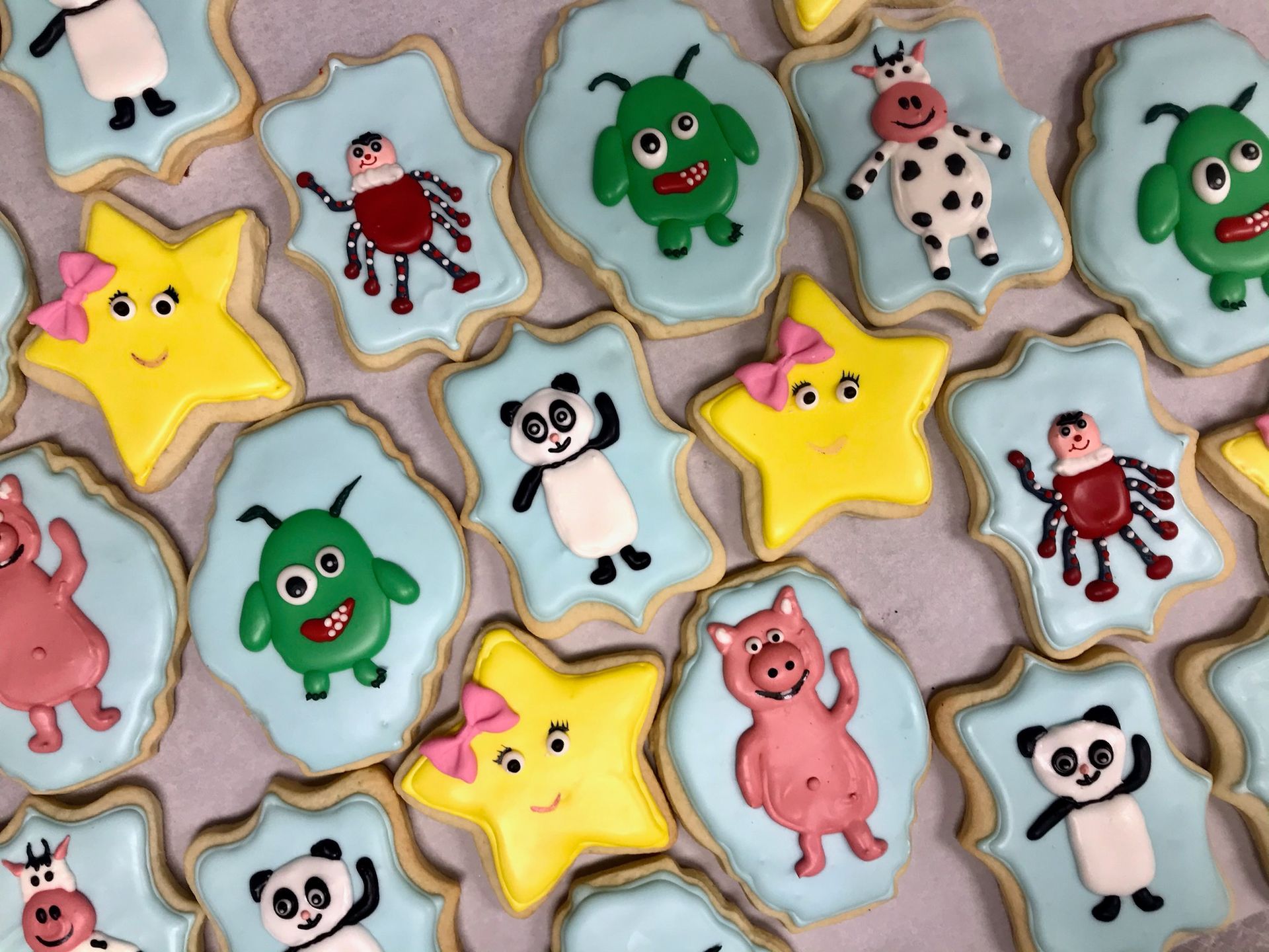 a bunch of cookies with different animals on them