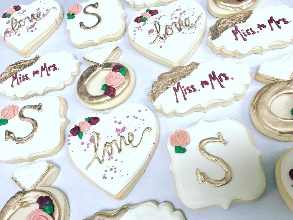 a bunch of cookies with the word love written on them