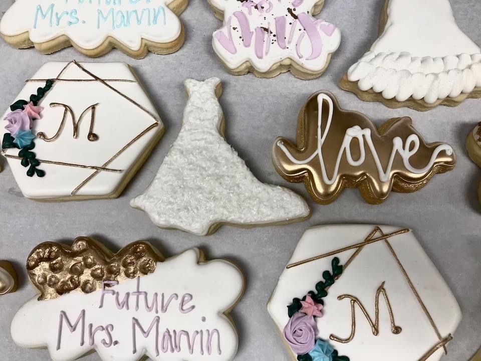 a bunch of wedding cookies with one that says future mrs. marvin
