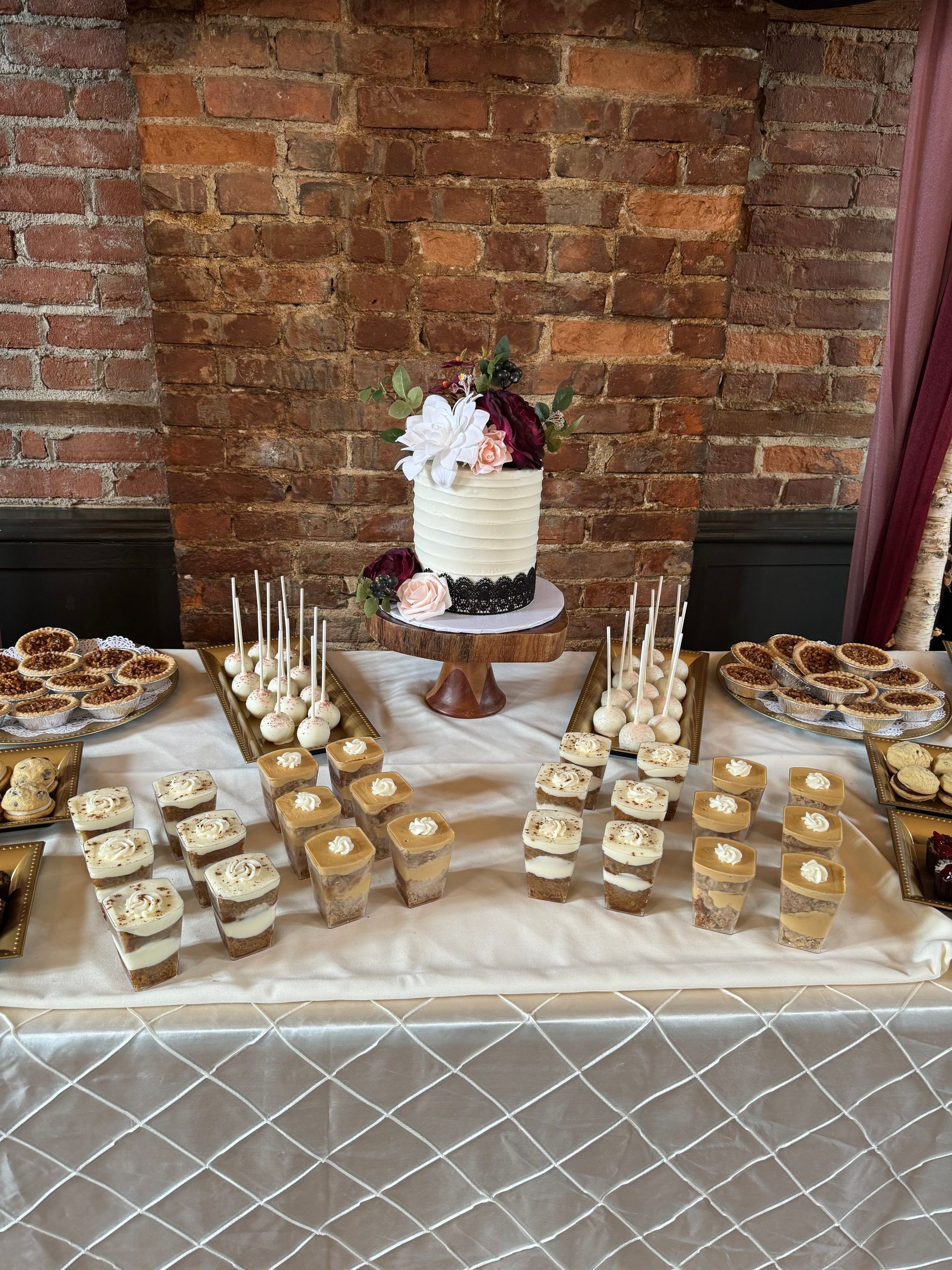 a table topped with plates of cookies and desserts .