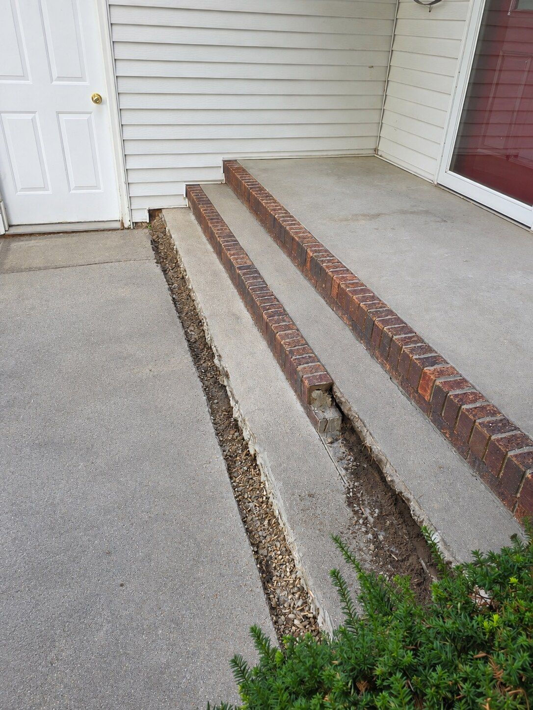 Cleaned demolition area around the original brick-edged steps
