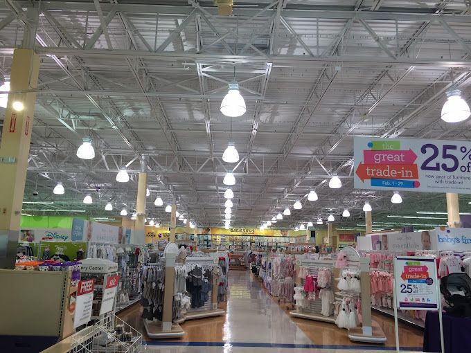 a row of clear glass pendant lights hanging from the ceiling