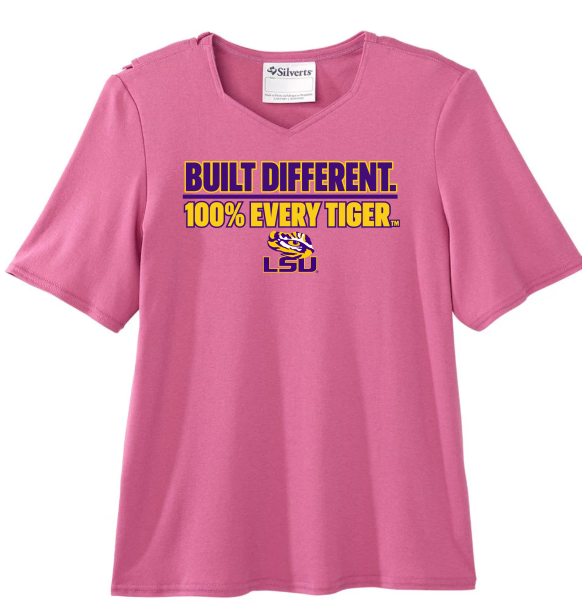 Pink LSU T-shirt with “BUILT DIFFERENT. 100% EVERY TIGER.” text in purple and gold