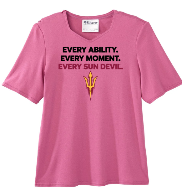 Pink T-shirt with black slogan text and a gold emblem on the chest