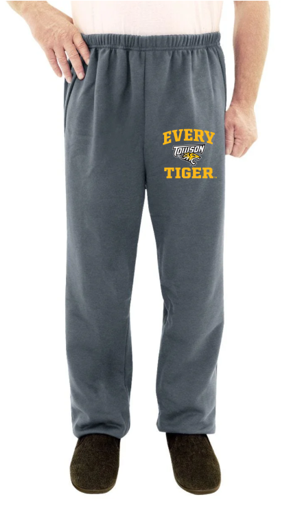 Gray sweatpants with “EVERY TIGER” printed in yellow on the left leg, worn with dark slippers.