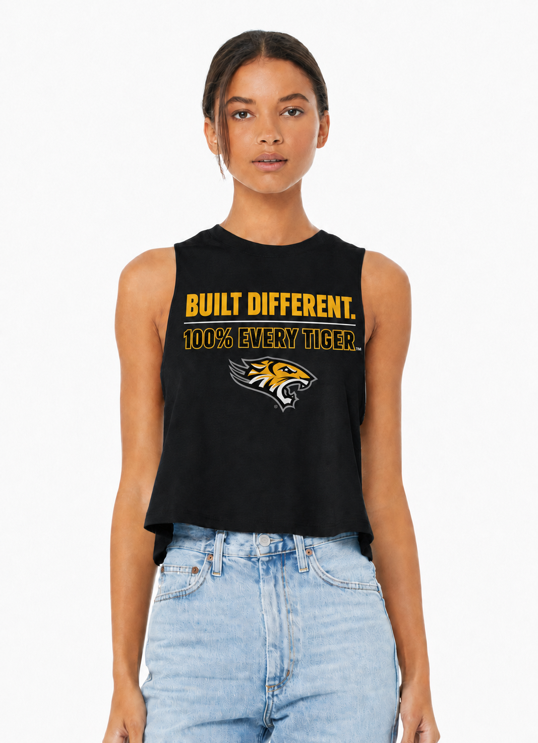 Model wearing a black sleeveless graphic top and light blue jeans on a white background