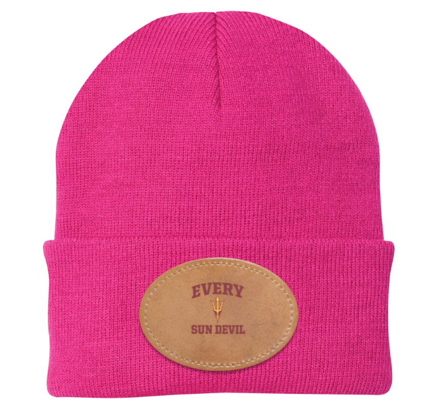 Bright pink knit beanie with folded cuff and tan patch label reading “EVERY” and “SKIN DEEP.”