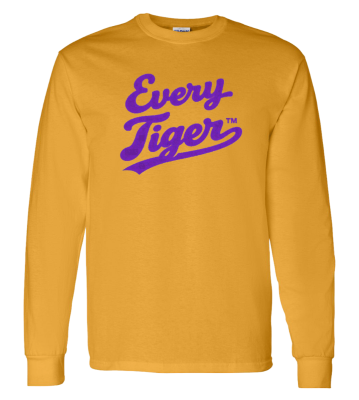 Mustard yellow long-sleeve shirt with purple “Every Tiger” lettering and small TM mark