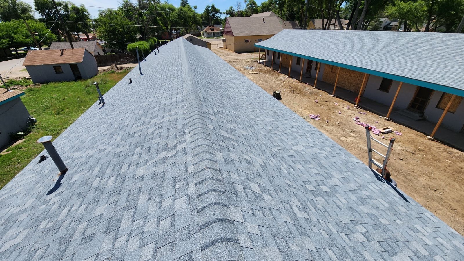 An aerial view of a roof with a lot of shingles on it.