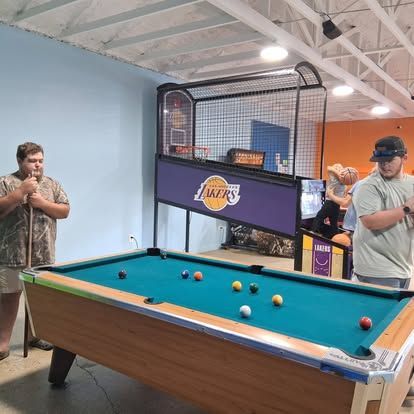 Customers playing pool