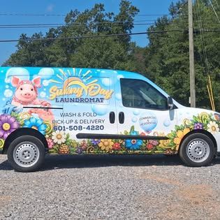 Sunny Day Laundromat branded delivery van
