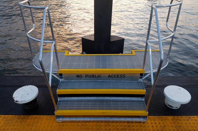 A set of stairs leads to a body of water.