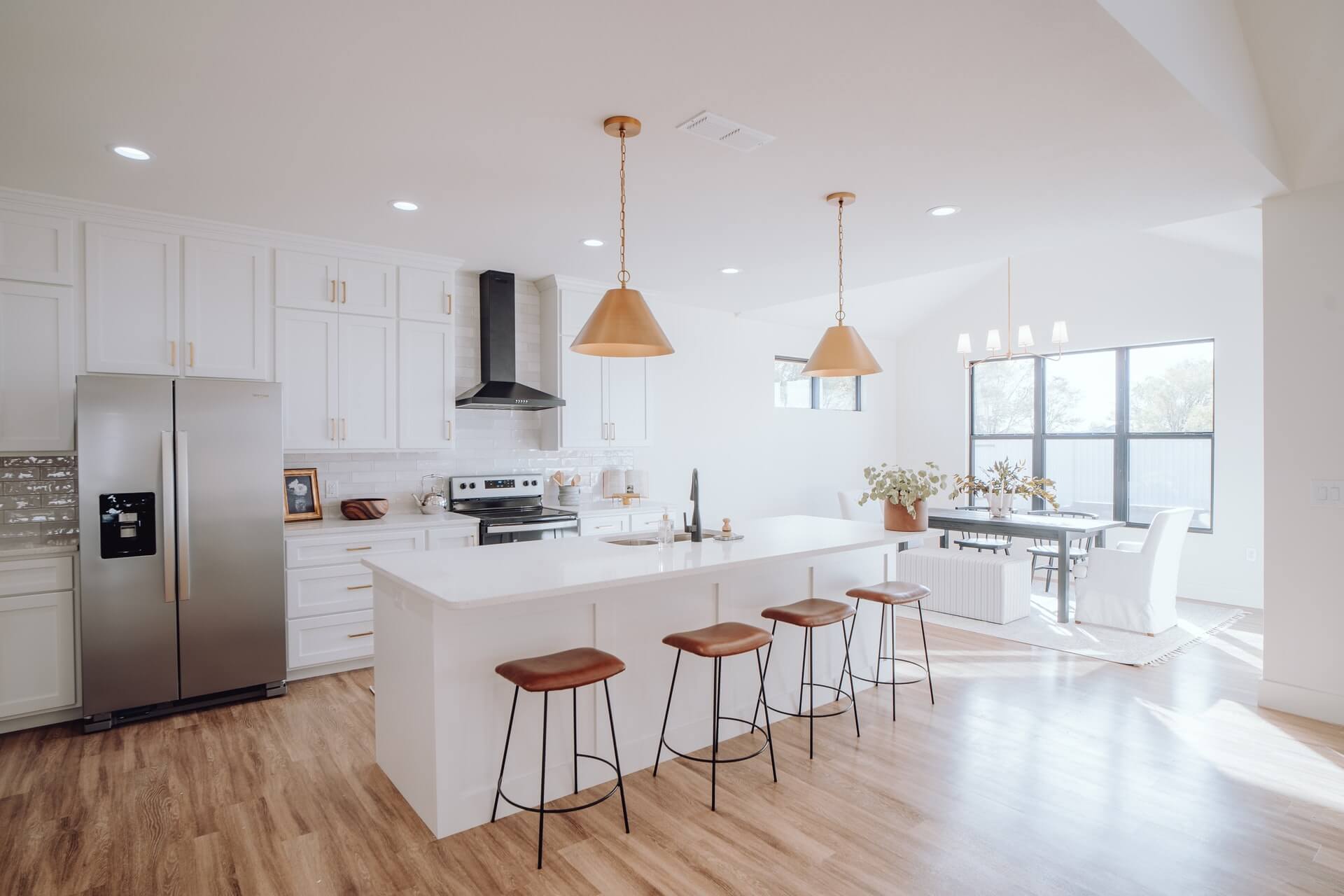 Modern white kitchen cabinets with doors and gold accents
