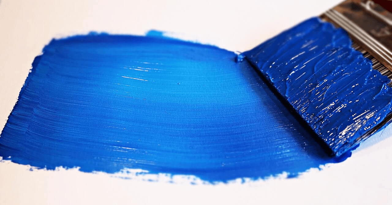 Paint brush and more supplies you will need to remove paint from kitchen cabinets