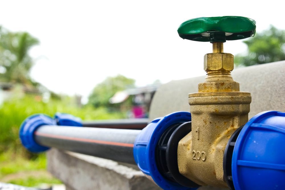 A Close Up Of A Water Valve With A Green Handle — Blackpoly Pipelines in Orange, NSW