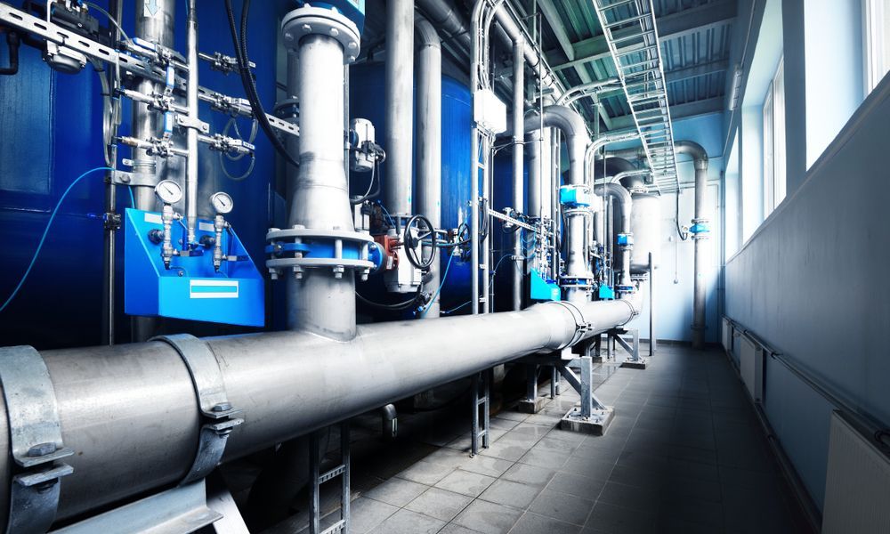 A Hallway Filled With Pipes And Machinery In A Factory — Blackpoly Pipelines in Forbes, NSW