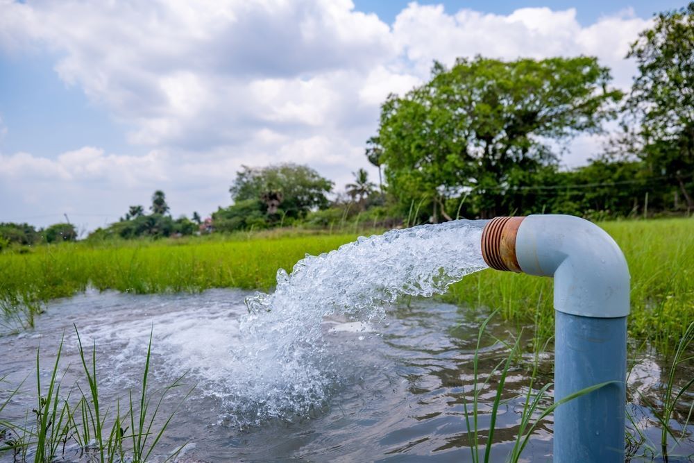 A Pipe Is Pumping Water Into A Field — Blackpoly Pipelines in Cowra, NSW