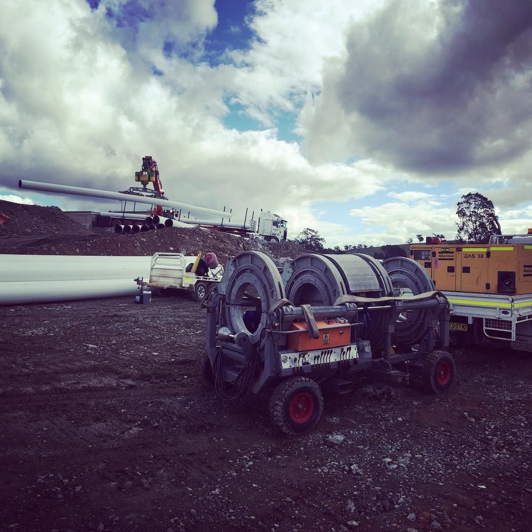 A Tractor Is Carrying A Bunch Of Rolls Of Wire — Blackpoly Pipelines in Orange, NSW