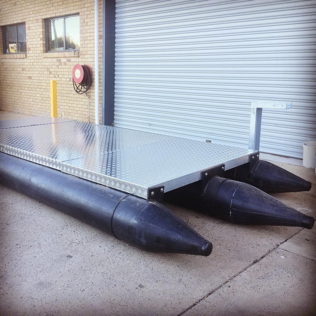 A Boat Is Sitting On The Ground In Front Of A Garage Door — Blackpoly Pipelines in Forbes, NSW