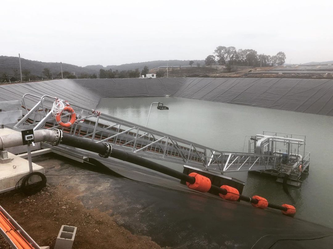 A Large Body Of Water With A Dock In The Middle Of It — Blackpoly Pipelines in Bathurst, NSW