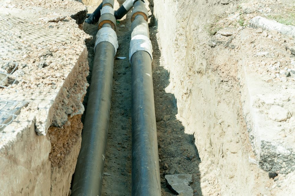 Two Pipes Are Connected To Each Other In A Trench — Blackpoly Pipelines in Cowra, NSW