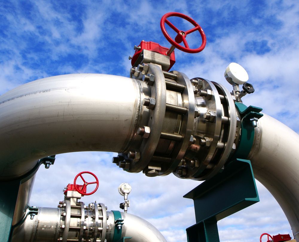 A Stainless Steel Pipe With A Red Valve On It — Blackpoly Pipelines in Mudgee, NSW