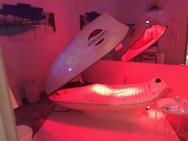Woman Lying in a Cocoon Pro Pod — Solon, OH — Core Elite Wellness Fit Cryo LLC