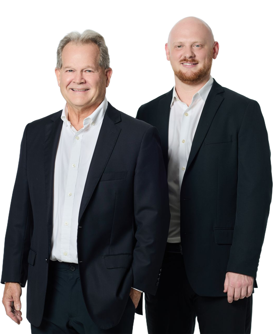 Two men in dark suits standing side by side against a white background