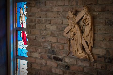 a statue of jesus carrying a cross