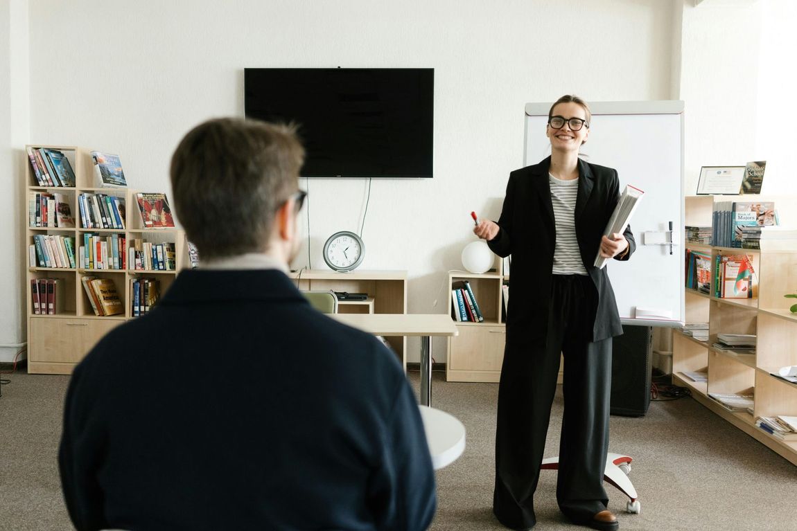 A social prescriber giving a presentation to a man about his options.