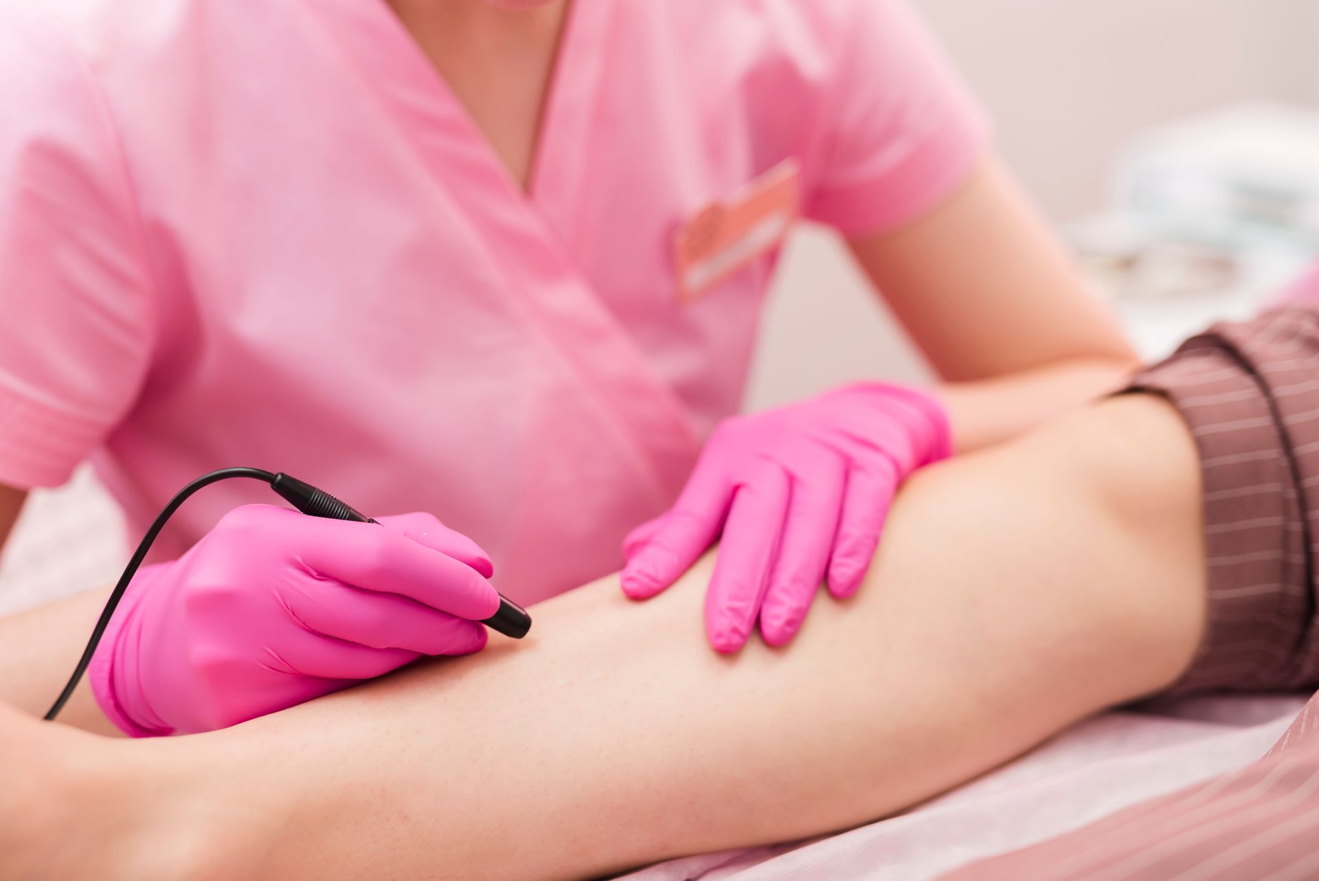 A Woman In A Bikini Is Getting A Spray Tan — Skin Care Centre of Cairns In Cairns City, QLD
