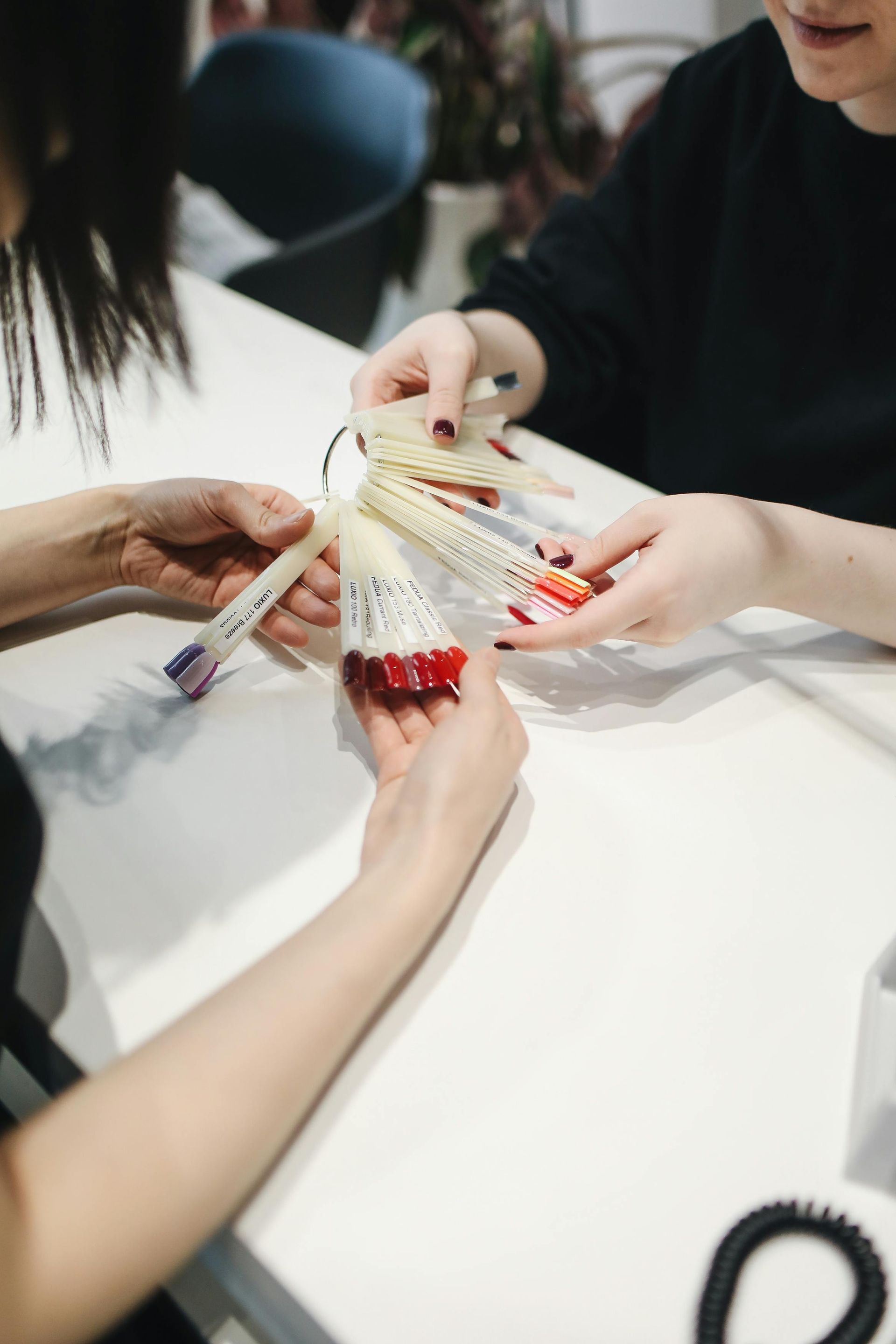 A Woman Is Getting Her Nails Painted By A Nail Artist — Skin Care Centre of Cairns In Cairns City, QLD