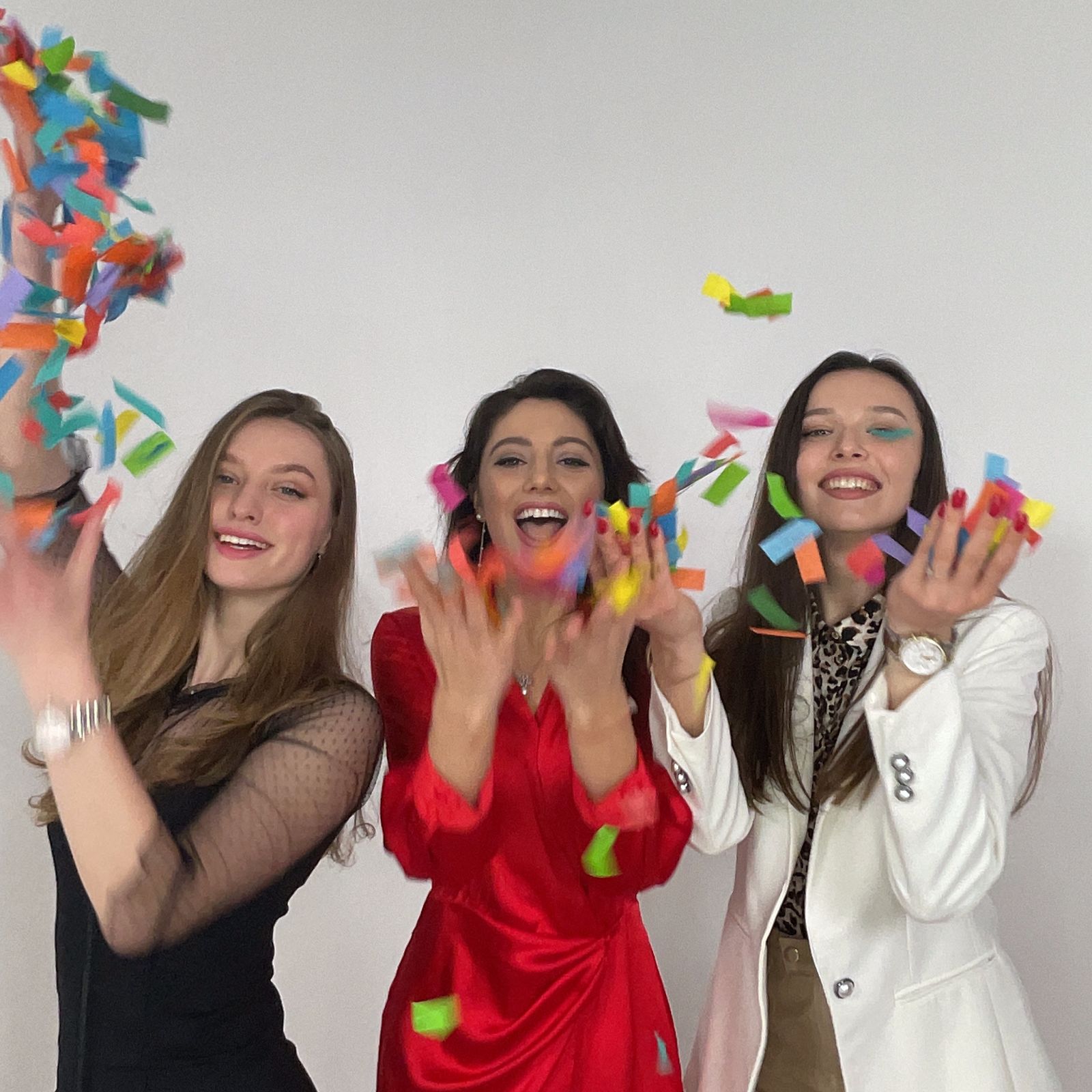 Happy Women Throwing Confetti