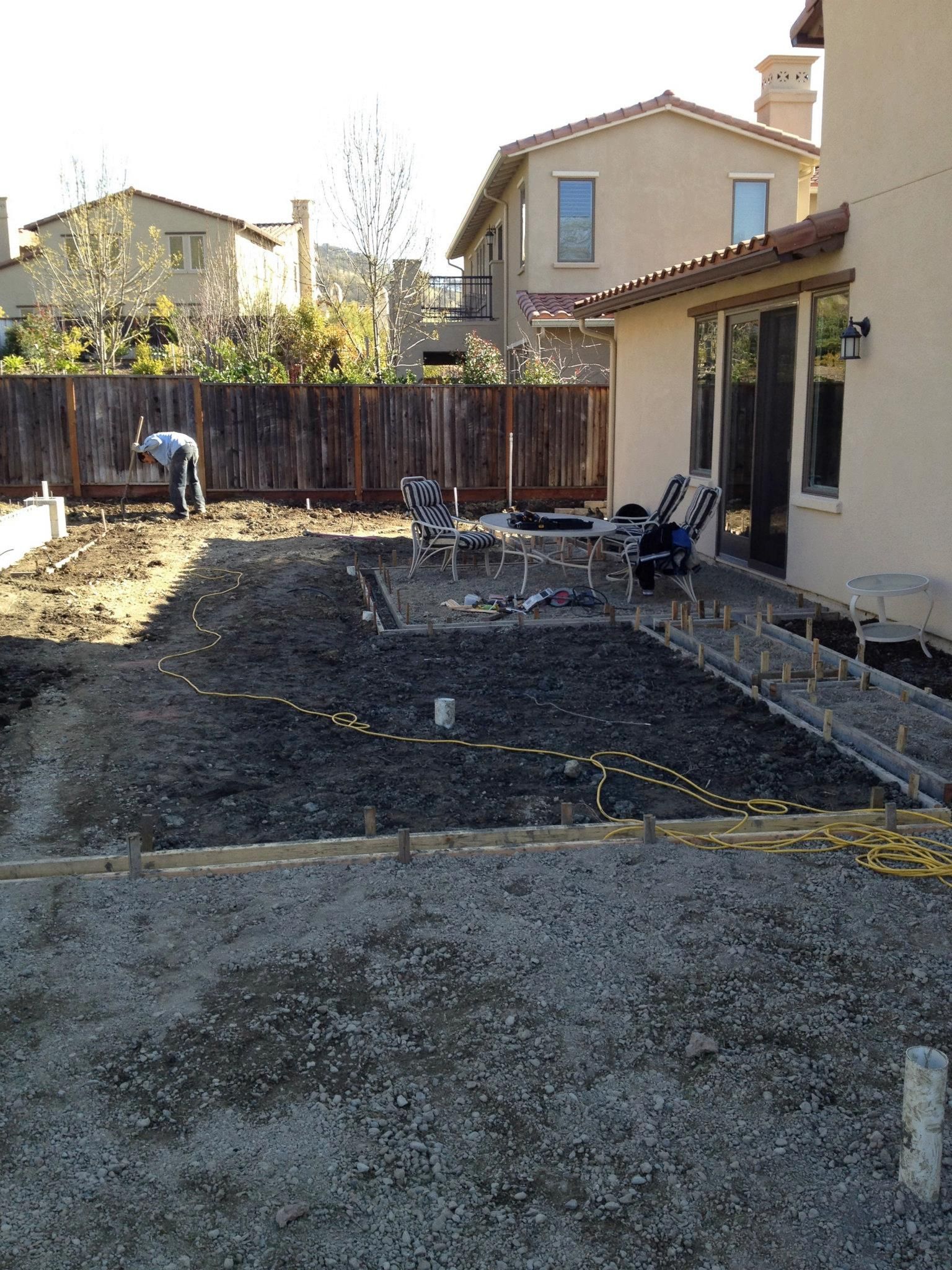 A man preparing the soil for new turf - Turfworks, Inc., your trusted partner for landscape design in Vacaville, CA