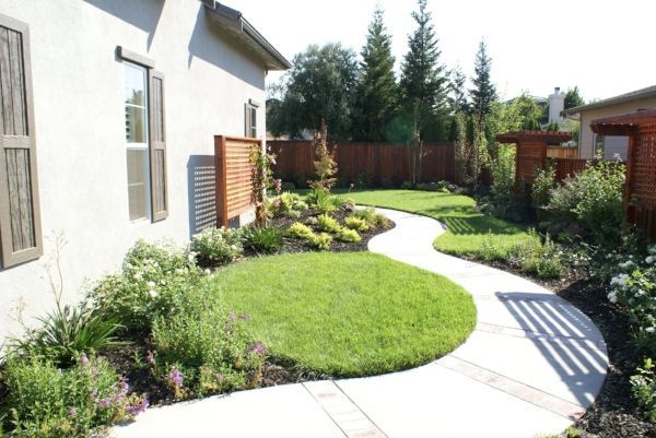 A house with a concrete walkway leading to it | landscape design in Davis, CA