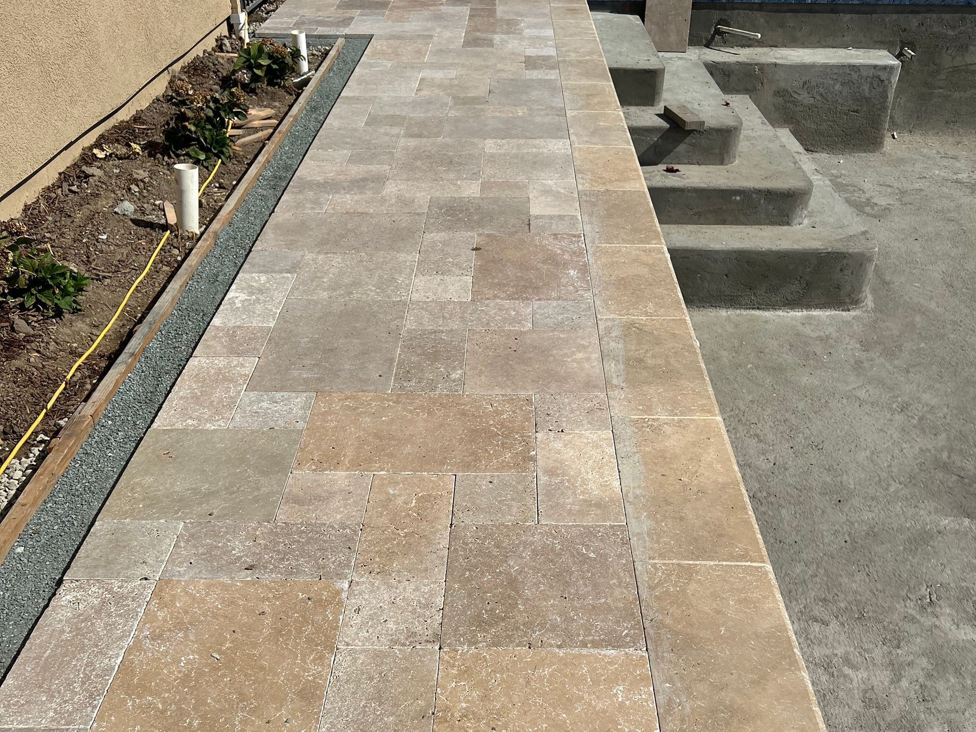 A paver walkway leading to a swimming pool | Landscape Design in Davis, CA