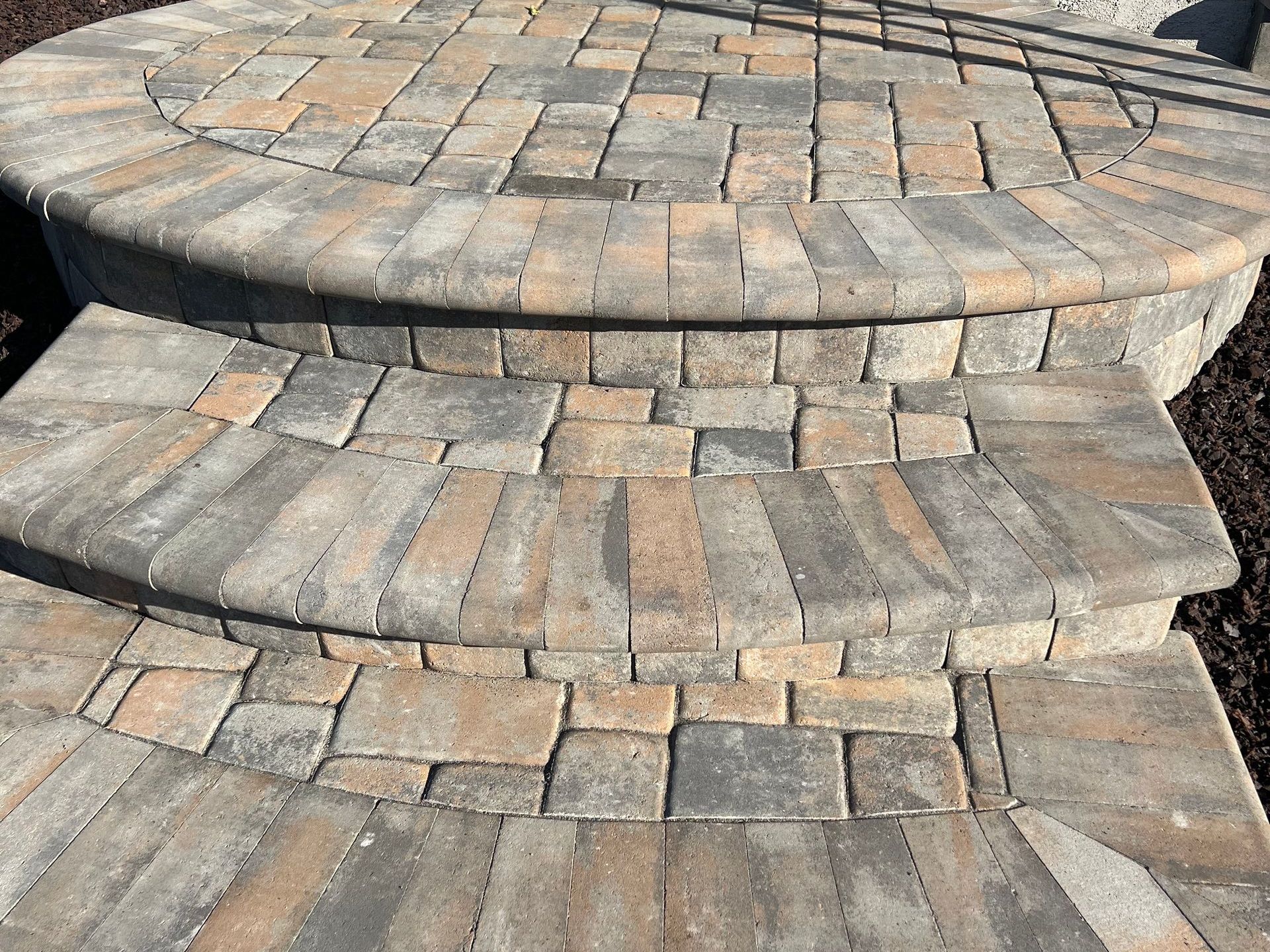 A set of brick steps leading up to a patio for a landscape design in Davis, CA.