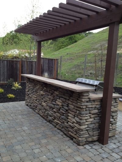 Outdoor space and kitchen designed by Vacaville's best landscape company - Turfworks, Inc.