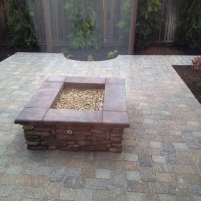 Beautifully designed paver patio and stone fire pit by Turfworks, Inc., a paver contractor in Vacaville, CA.