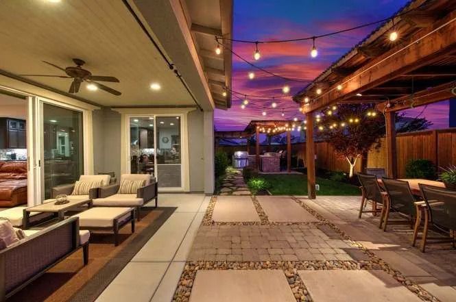 A patio with a beautiful string of outdoor lights - Looking for Landscaping near me in Vacaville, CA - Contact Turfworks Inc.
